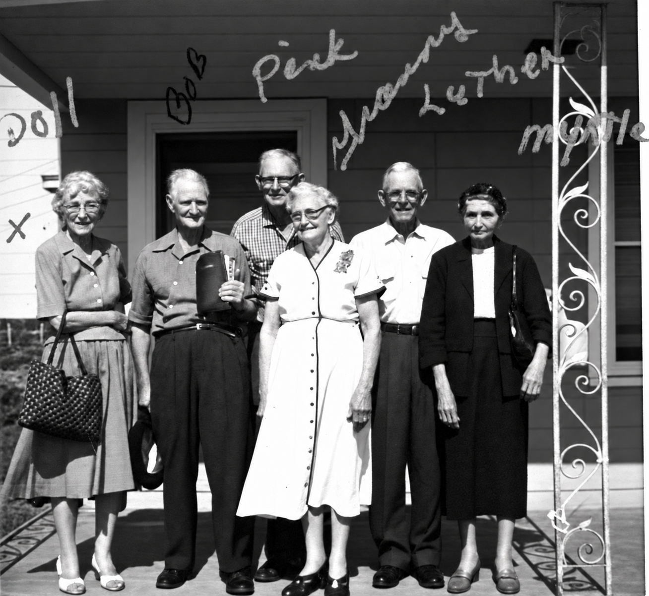 Granny Carden with her brothers and sisters, six people standing together on a porch, with handwritten names above them