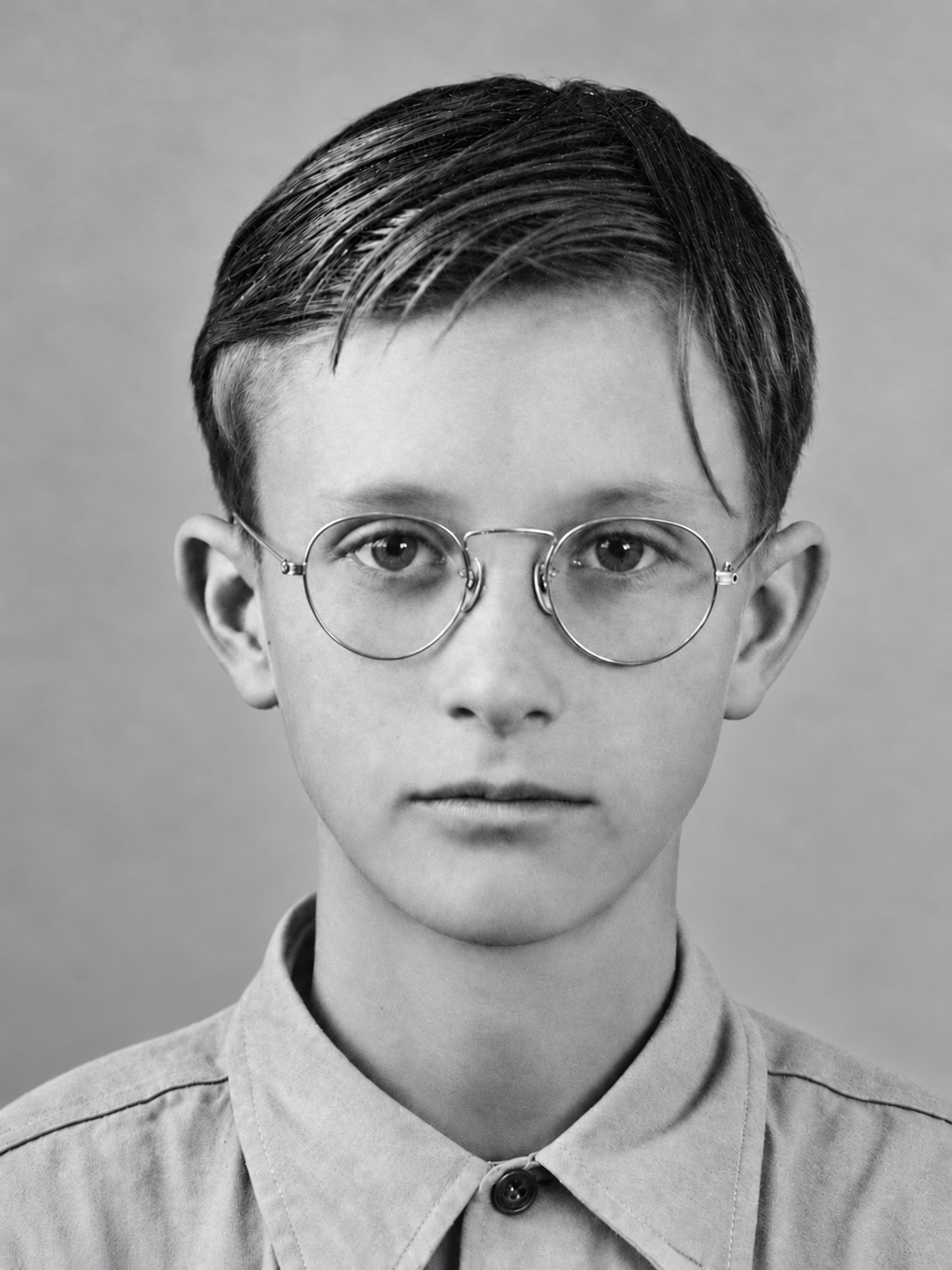 Alvin Donald “Don” Hensley as a child, wearing round glasses