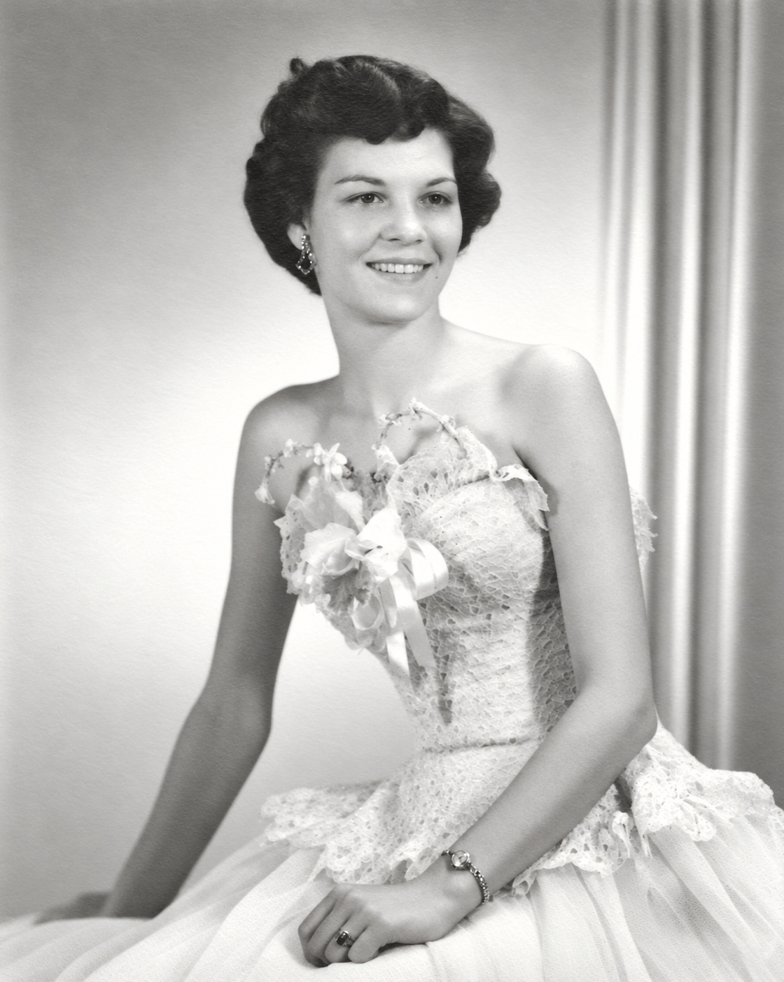 Patsy Ruth Anderson Childress in a restored black-and-white seated portrait, wearing a formal dress and corsage