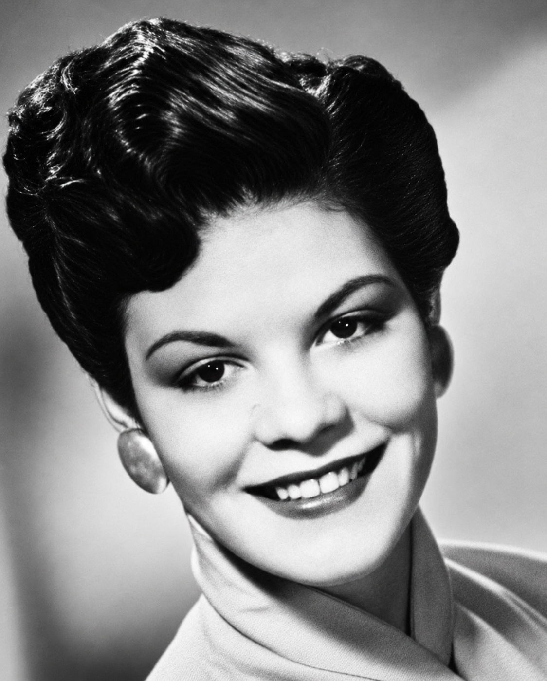 Black-and-white headshot of Patsy Ruth Anderson Childress smiling