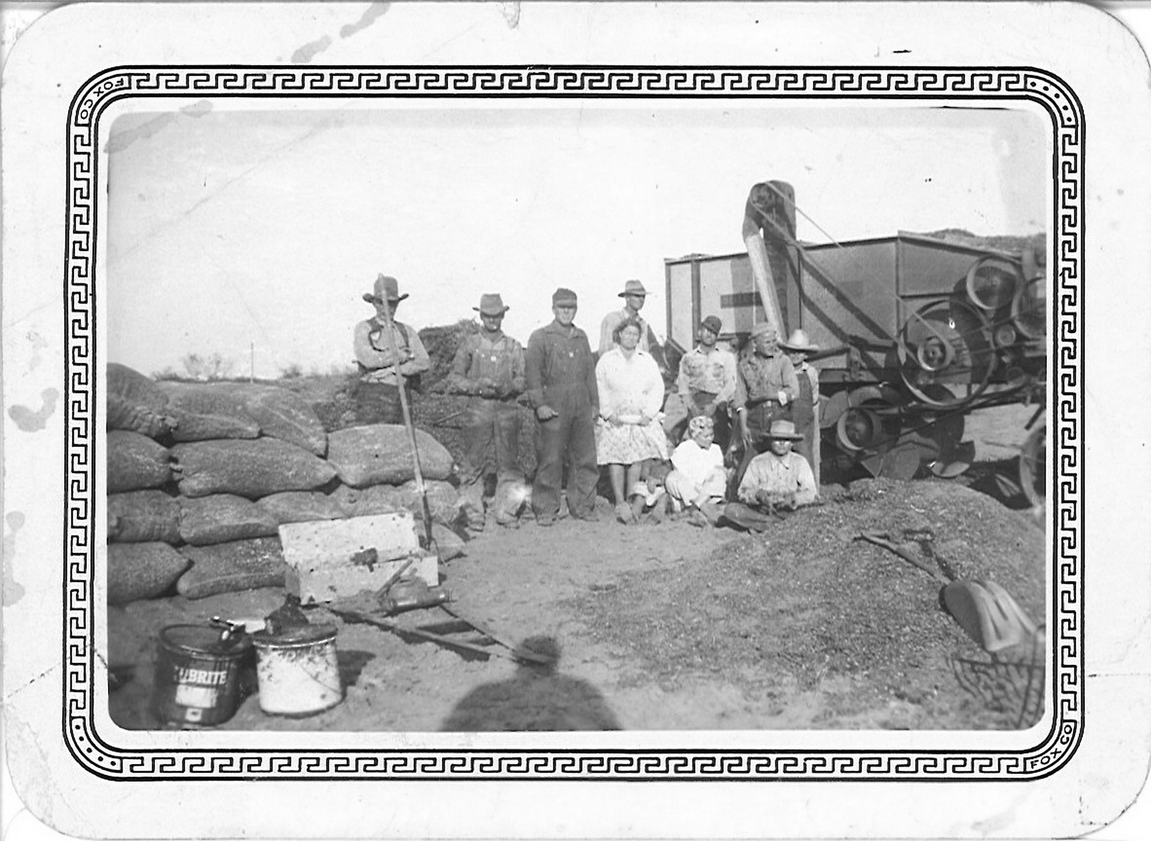 Restored peanut-harvest photograph showing members of the Perry family and Ramon