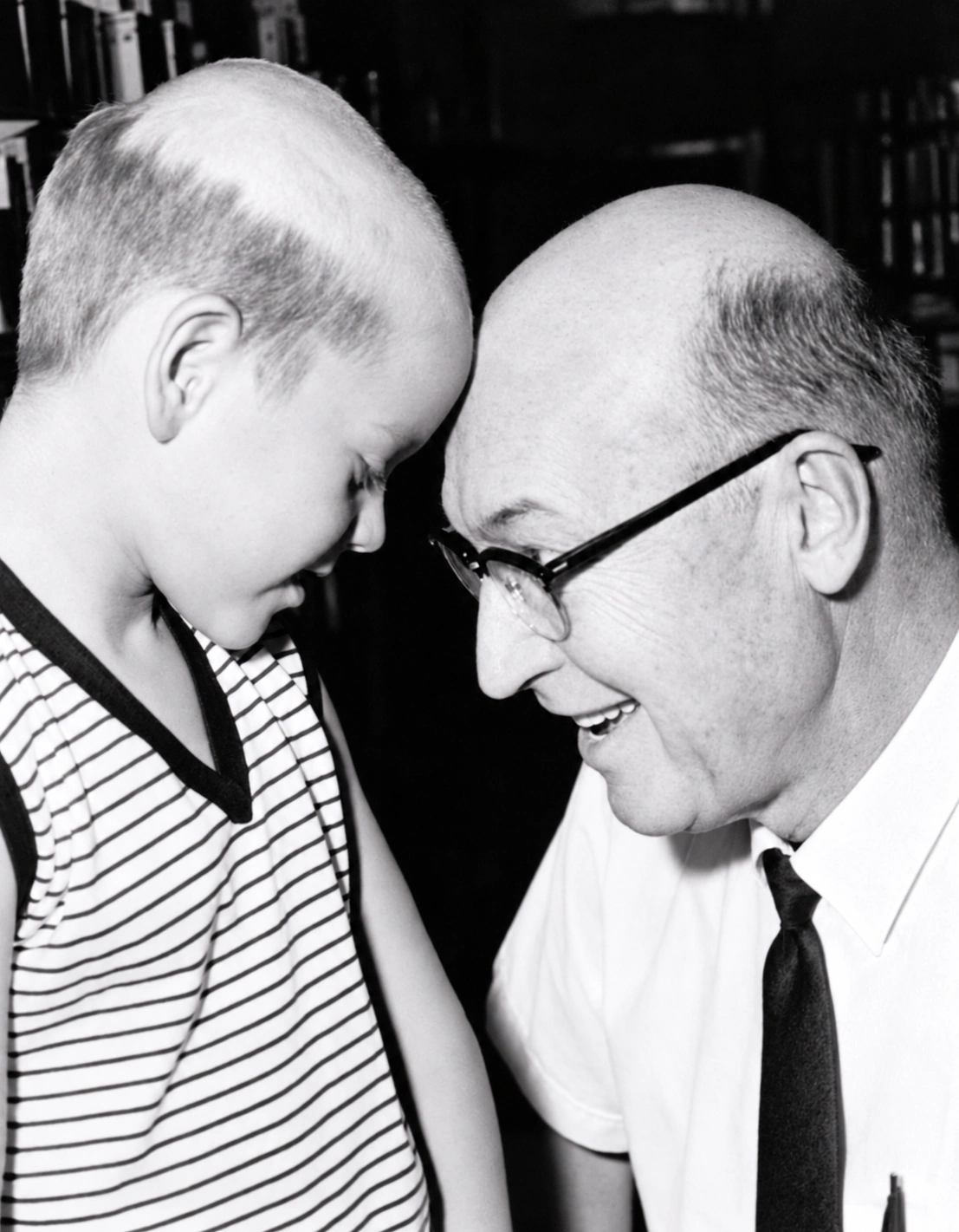 Perry Wayne Hollingsworth as a boy, at left, touching foreheads with Mr. Massey at right