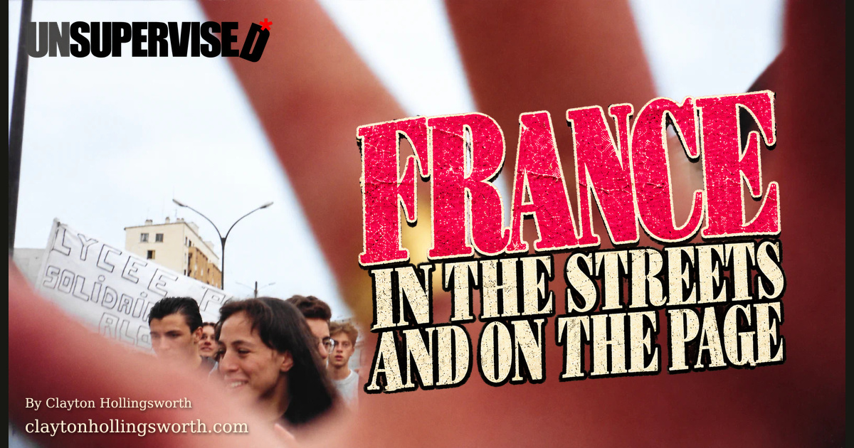 France in the Streets and on the Page — the hand-and-student-protesters photograph fills the card, with distressed magenta and cream headline lettering across the hand. Official UNSUPERVISED* wordmark and claytonhollingsworth.com.